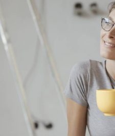 Person relaxing after installing photoelectric smoke alarms