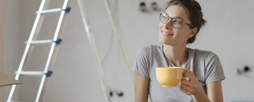 Person relaxing after installing photoelectric smoke alarms